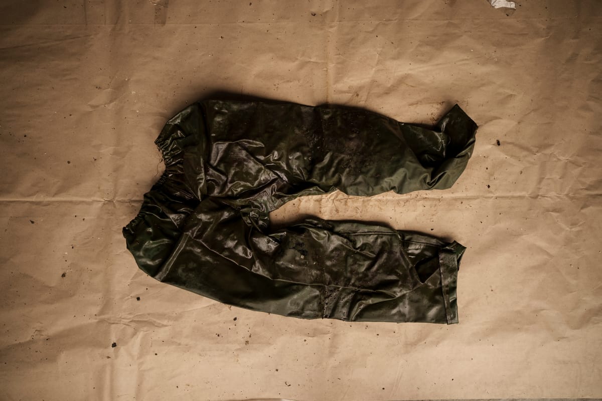 A pair of green weatherproof pants